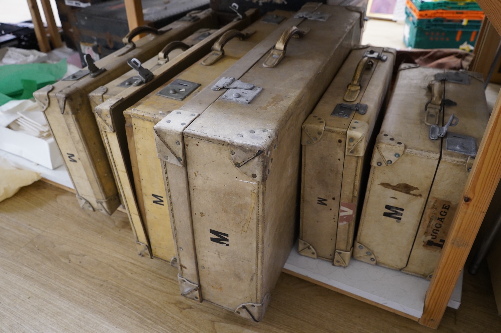 A collection of pig hide vintage luggage comprising six vintage travelling trunks
